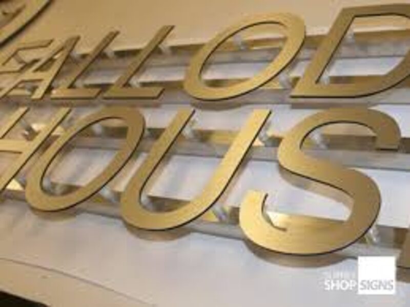 ACM cut-out lettering — interior reception branding