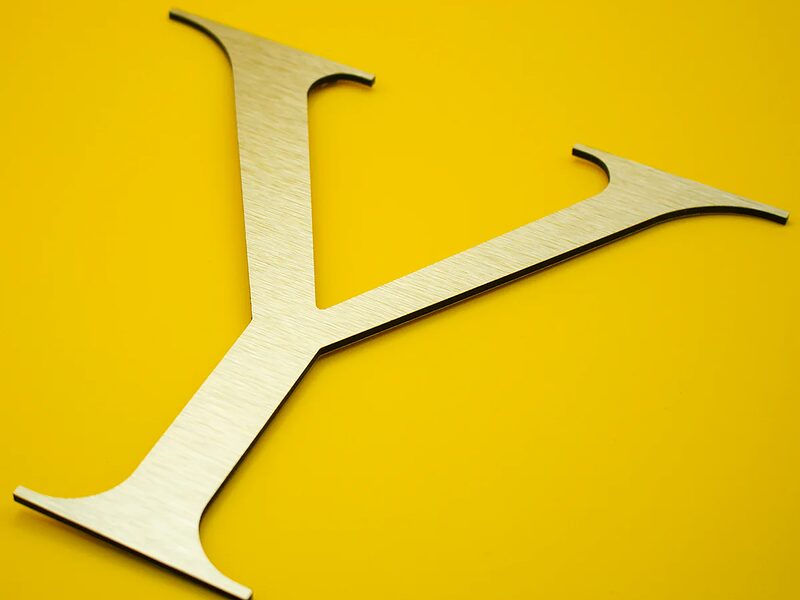 Brushed gold finish ACM letters — shopfront installation