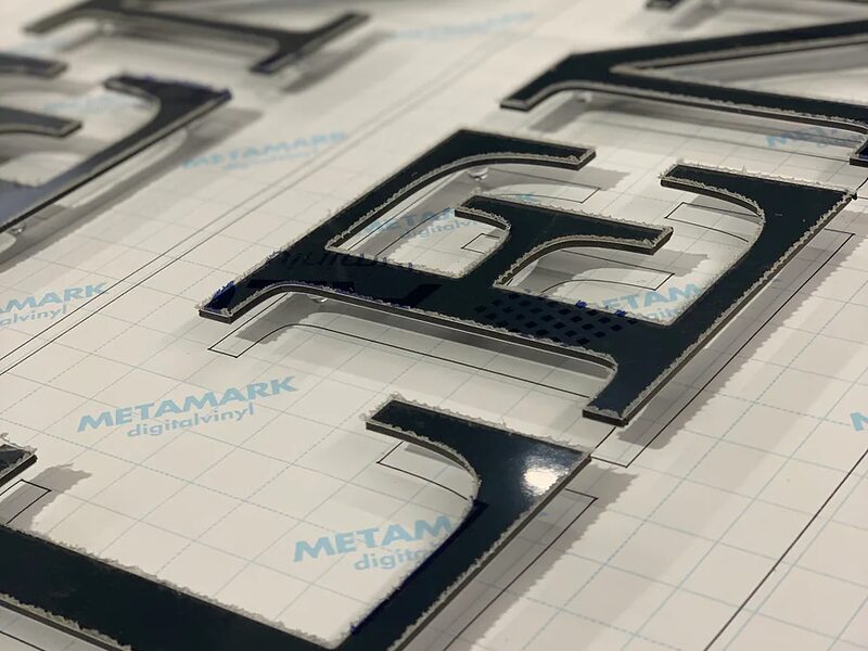 CNC cut flat ACM letters with floating stand-off mount