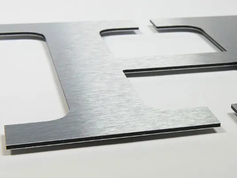 Brushed aluminium composite letters — retail fitout